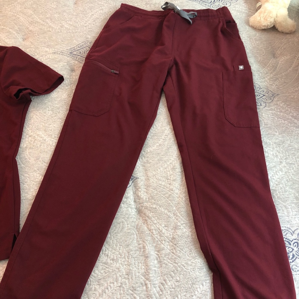 A burgundy women’s FIGS set - technical collection